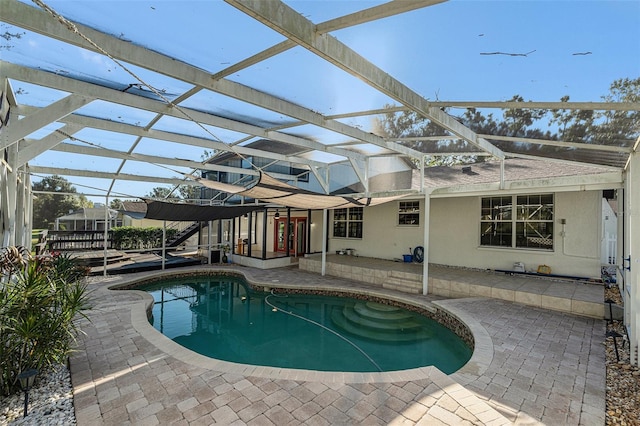 view of pool featuring a patio area and a lanai