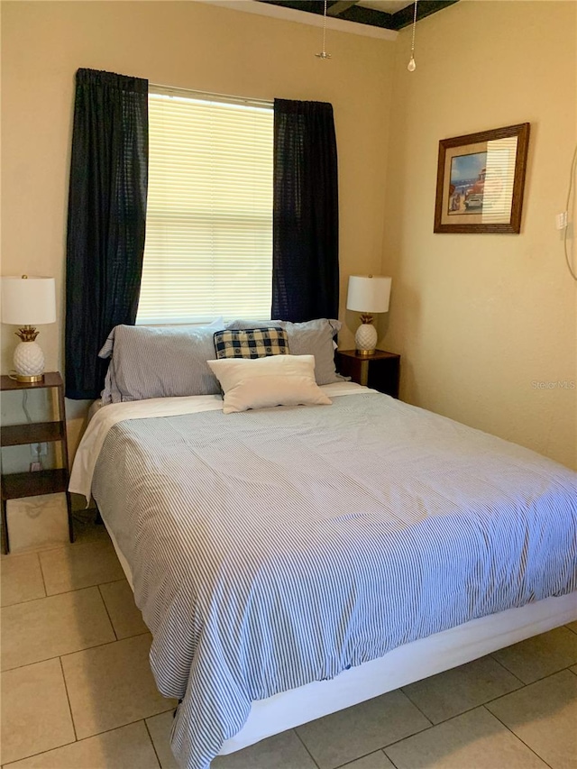 bedroom featuring tile patterned flooring