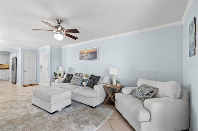 living room with ceiling fan, light tile patterned floors, and ornamental molding