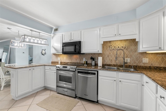 kitchen with sink, white cabinetry, stainless steel appliances, and hanging light fixtures