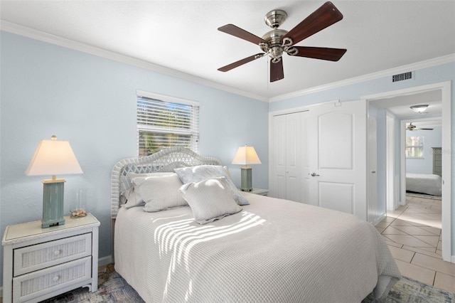 bedroom featuring ceiling fan, a closet, multiple windows, and crown molding