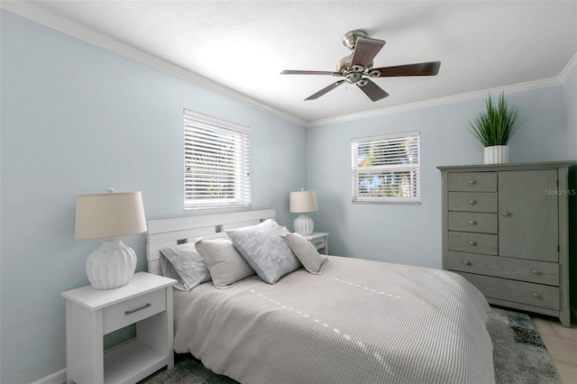 bedroom with ceiling fan, light tile patterned floors, and ornamental molding