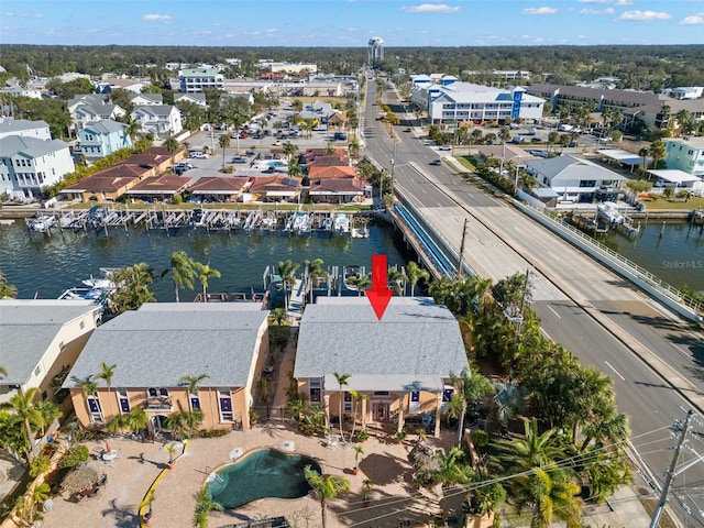 aerial perspective of suburban area featuring a nearby body of water