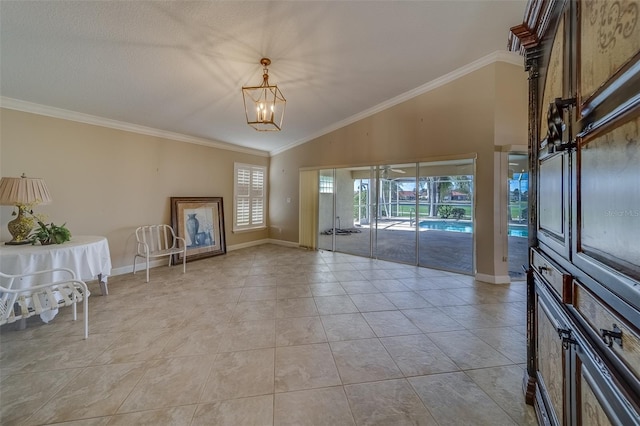 interior space with light tile patterned floors, vaulted ceiling, ornamental molding, and a notable chandelier