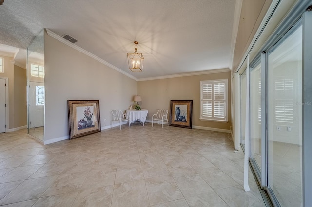 unfurnished room with a notable chandelier and ornamental molding