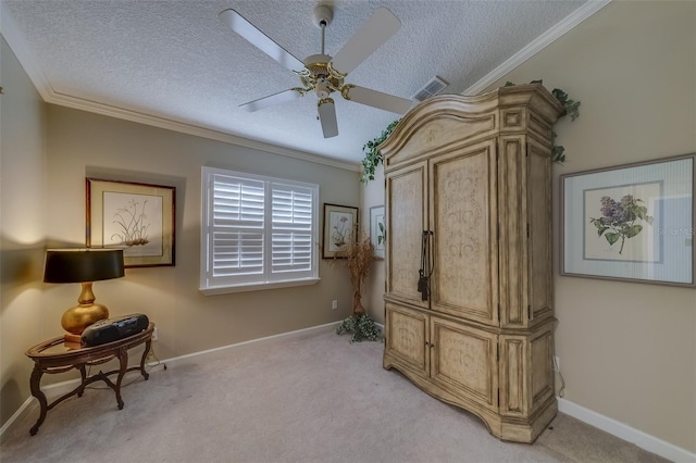 living area featuring a textured ceiling, light colored carpet, ceiling fan, and crown molding