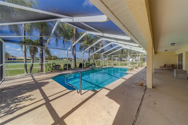 view of pool with a patio area and glass enclosure