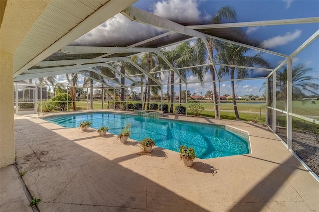 view of pool featuring a lanai and a patio area