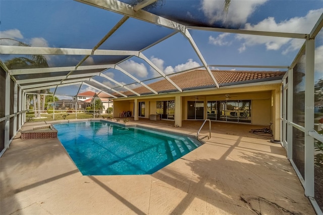 view of pool featuring ceiling fan, a lanai, and a patio