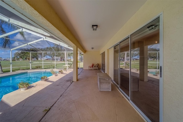 view of swimming pool with a patio and glass enclosure