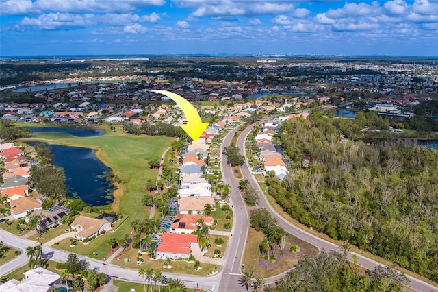 birds eye view of property with a water view