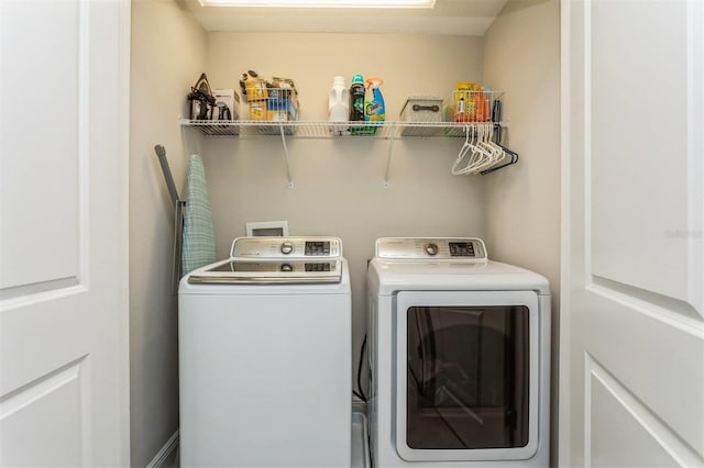 laundry room with washer and dryer