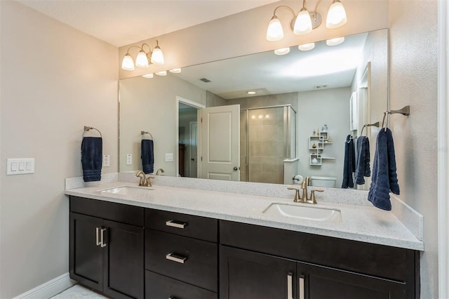 bathroom with vanity, toilet, and an enclosed shower