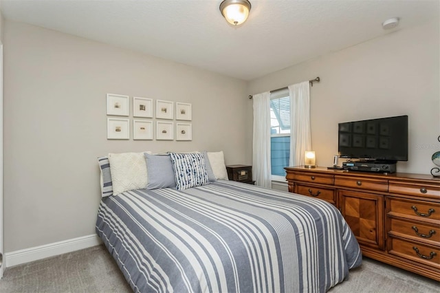 bedroom with light carpet