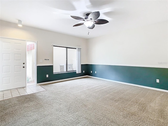 empty room with ceiling fan and light colored carpet