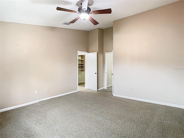 unfurnished room featuring light carpet and ceiling fan