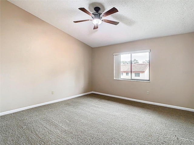 carpeted spare room with ceiling fan and a textured ceiling