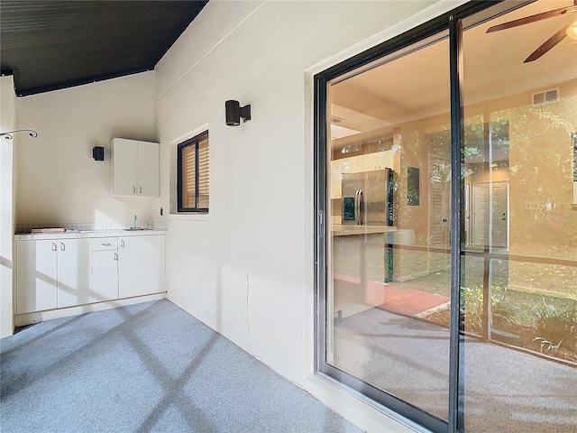 interior space with ceiling fan and vanity