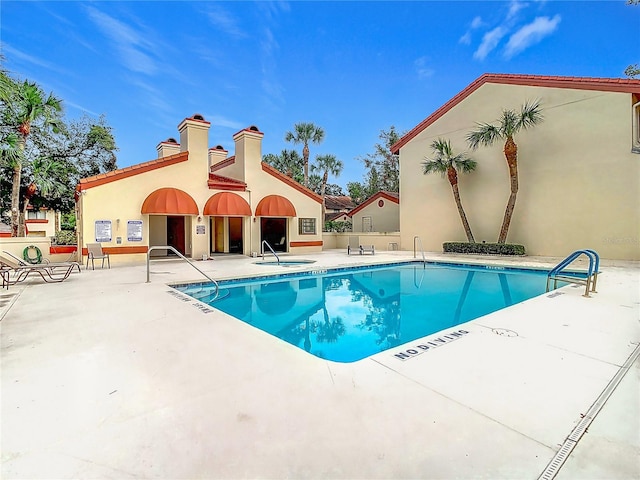 view of pool featuring a patio