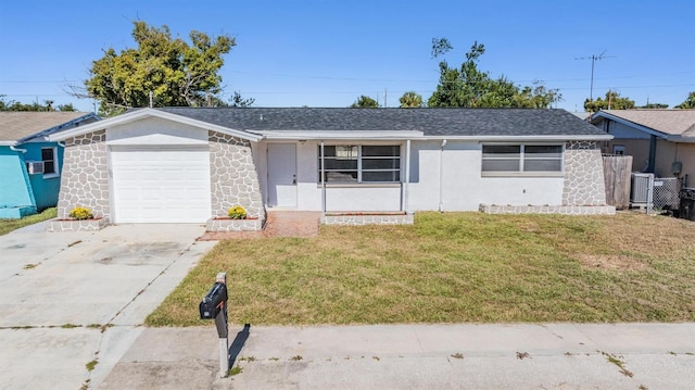 single story home featuring central AC unit, a front yard, and a garage