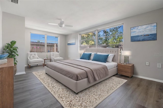 bedroom featuring ceiling fan and dark wood-type flooring