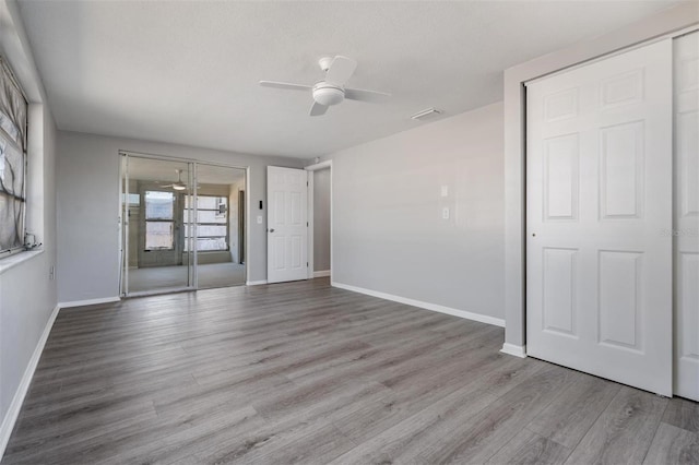 unfurnished room with light hardwood / wood-style floors and ceiling fan