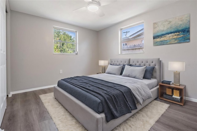 bedroom featuring ceiling fan and dark wood-type flooring