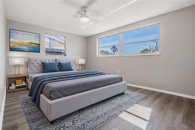 bedroom featuring hardwood / wood-style floors and ceiling fan