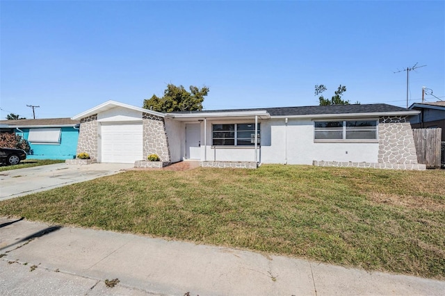 single story home featuring a front yard and a garage