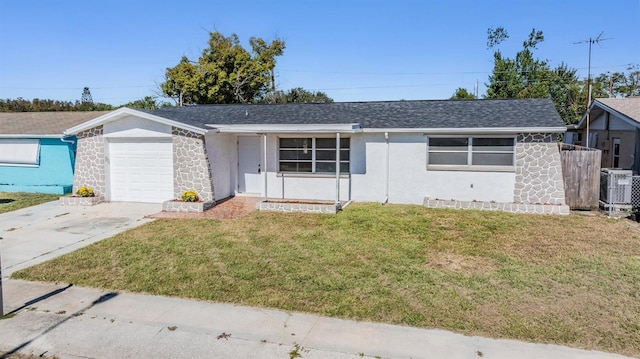 ranch-style house featuring cooling unit, a front lawn, and a garage