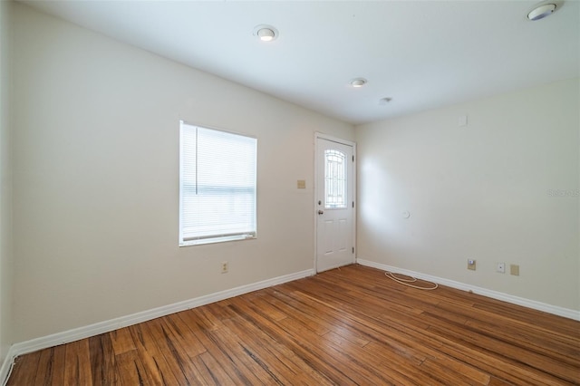 empty room with hardwood / wood-style floors