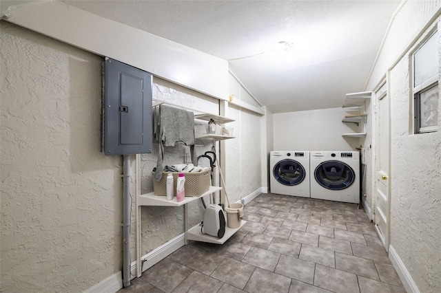 washroom with separate washer and dryer and electric panel