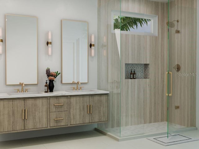 bathroom featuring tile patterned flooring, vanity, and tiled shower