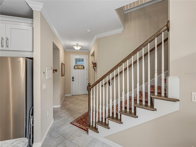 foyer featuring ornamental molding and light tile patterned floors