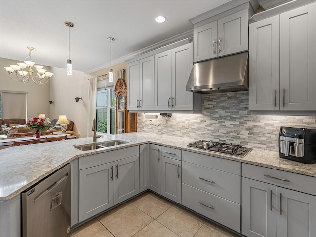 kitchen with a notable chandelier, pendant lighting, gray cabinets, appliances with stainless steel finishes, and ornamental molding