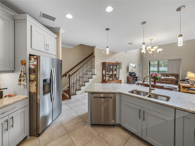 kitchen featuring crown molding, sink, gray cabinets, stainless steel appliances, and a chandelier