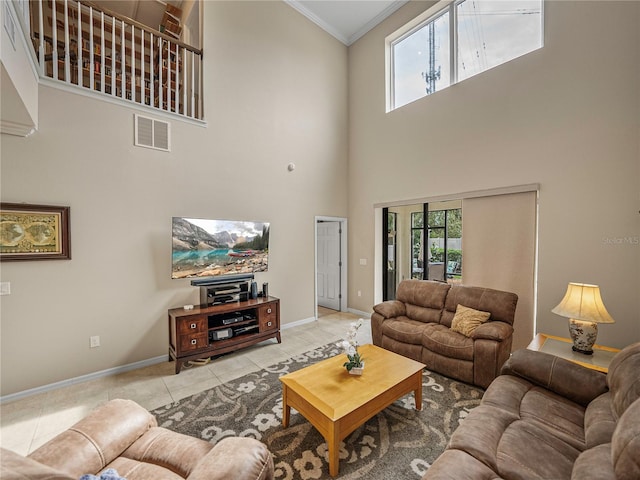 tiled living room with a high ceiling and ornamental molding