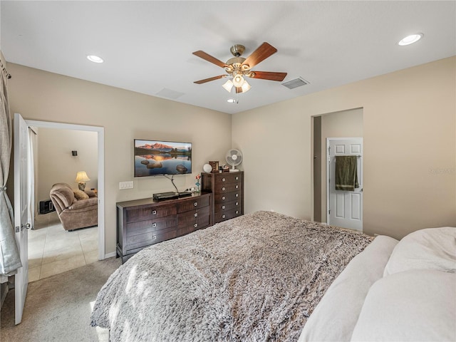 bedroom featuring ceiling fan and light colored carpet