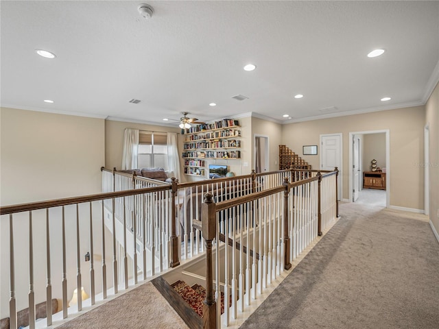 hallway featuring light colored carpet and ornamental molding