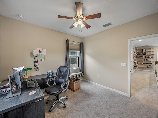 carpeted office with ceiling fan