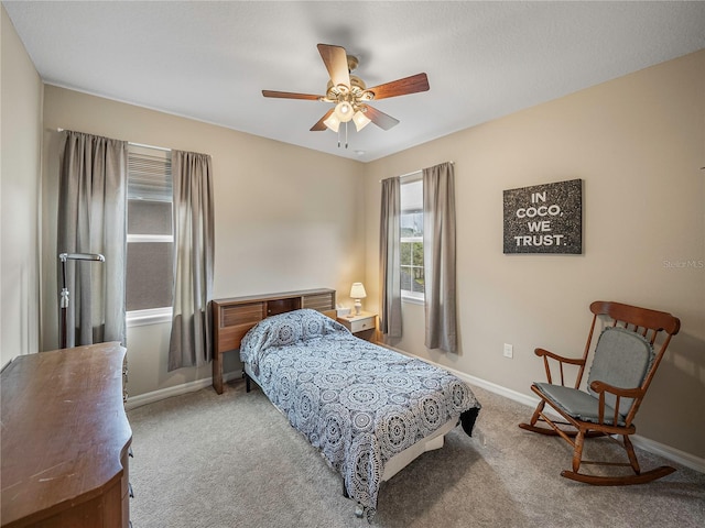 bedroom featuring ceiling fan and light colored carpet