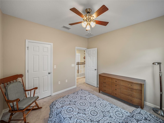 living area featuring ceiling fan and light colored carpet