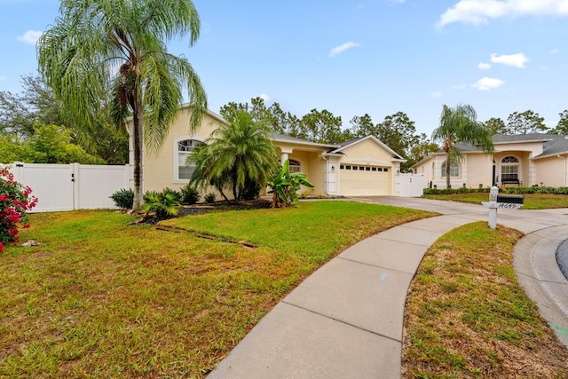 ranch-style home with a garage and a front lawn