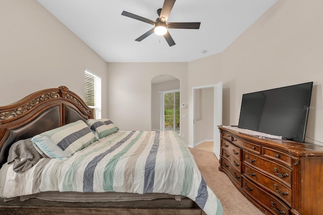 bedroom featuring light colored carpet and ceiling fan