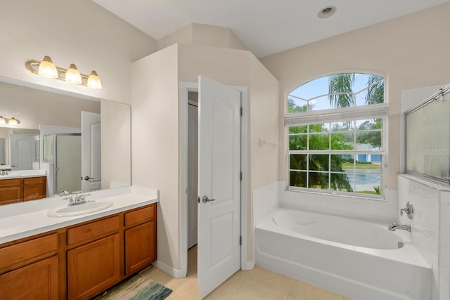 bathroom with tile patterned floors, vanity, and independent shower and bath