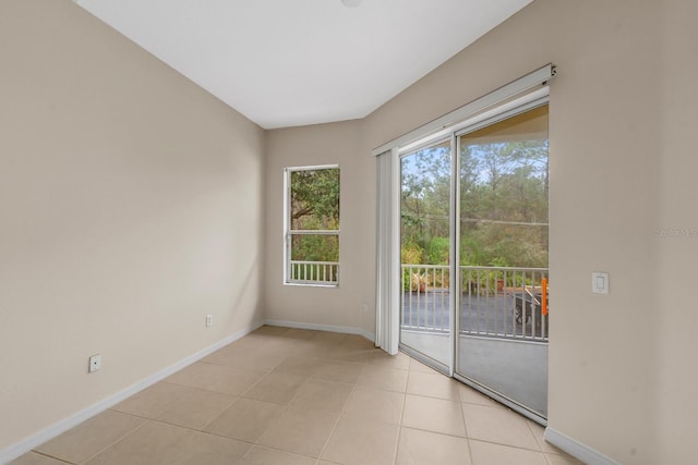 unfurnished room with light tile patterned floors