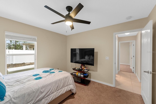 bedroom featuring light carpet and ceiling fan