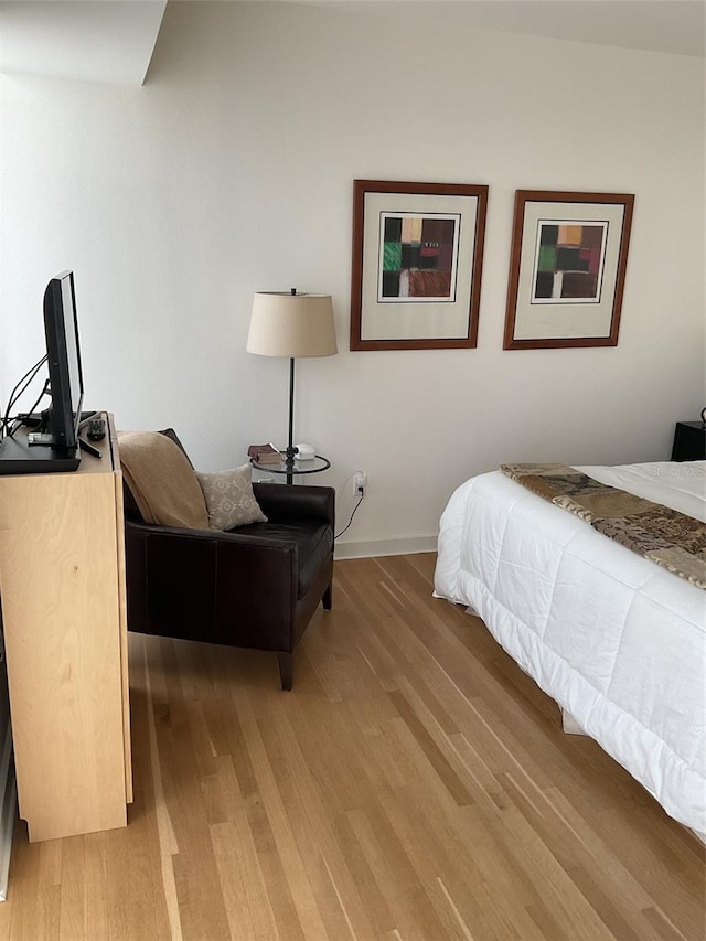 bedroom featuring wood-type flooring