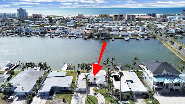 birds eye view of property featuring a water view