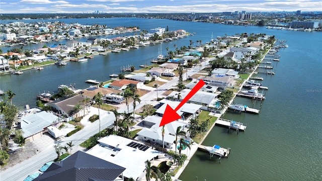 birds eye view of property featuring a water view